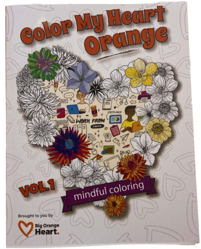 volume 1 of the color my orange heart colouring book front cover. It has a big heart shape made of different flowers, some of the flowers have been coloured in with different colours. In the middle of the heart are icons for things like books, email and headphones.